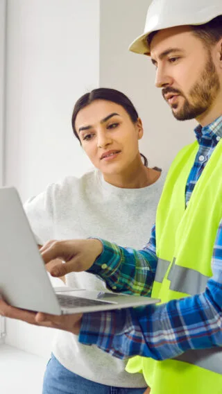 Person Talking To Contractor Adobe Stock 569275374