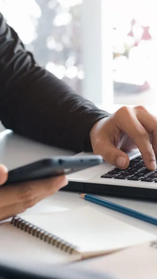 Contact Us Person at Computer Adobe Stock 449669986